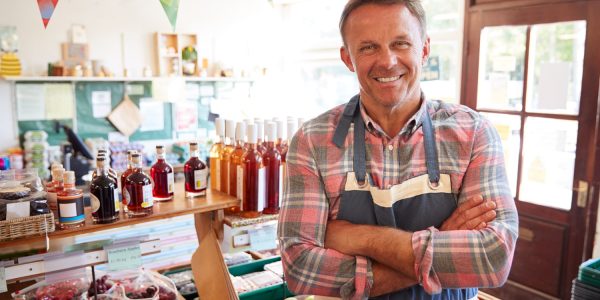 Portrait Of Mature Man Running Organic Farm Shop